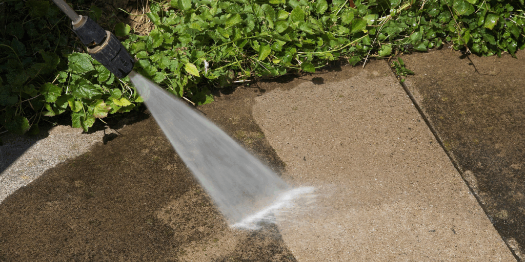 Driveway and sidewalk pressure washing service removing dirt and stains in West Chester, OH