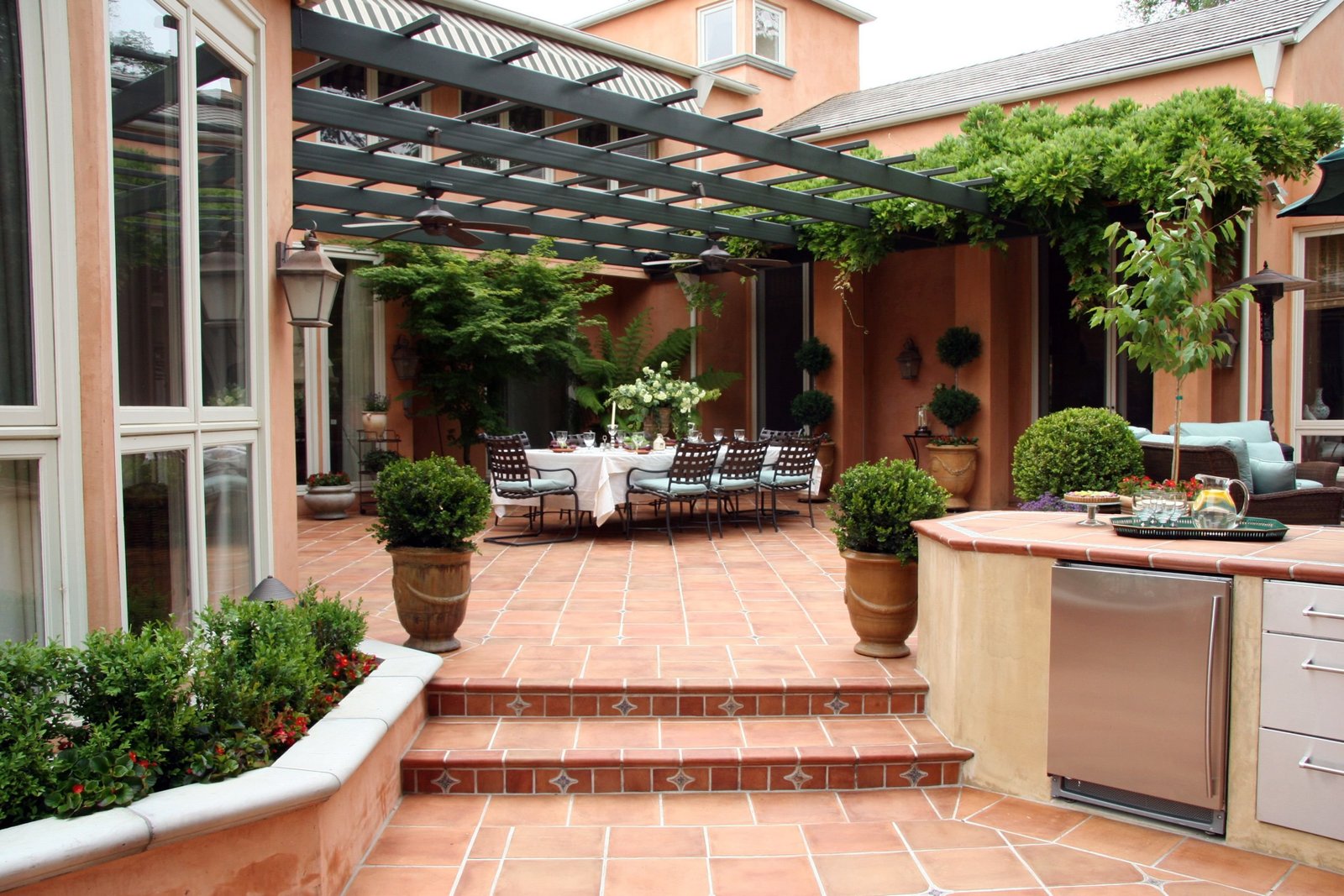 Beautiful outdoor patio with clean tile flooring and seating area after professional pressure washing in West Chester OH