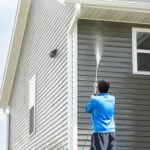 Pressure washing house exterior to remove dirt and grime in Ohio